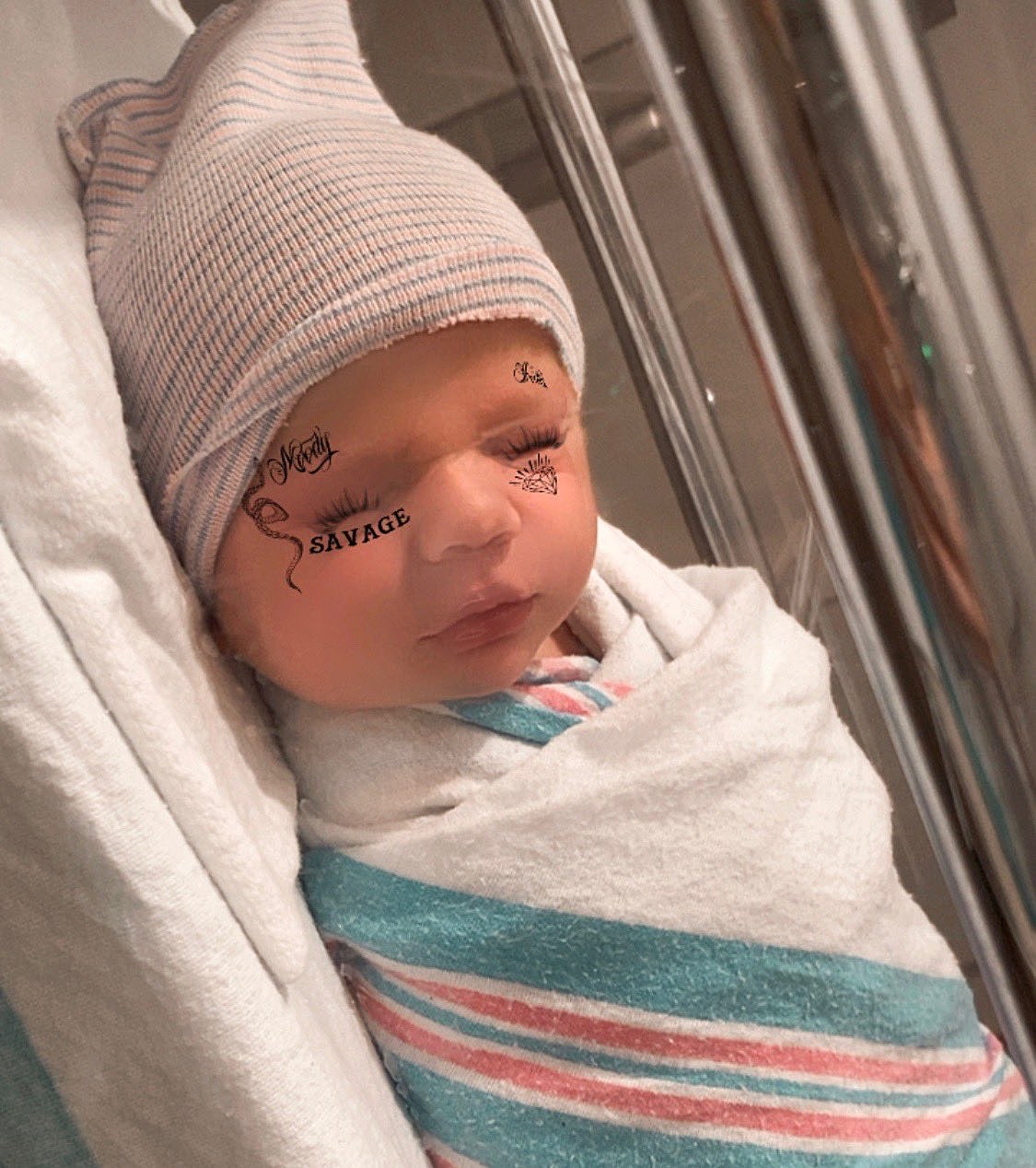 Grimes & Elon Musk named their new baby X Æ A-12, gave it a face-tat filter