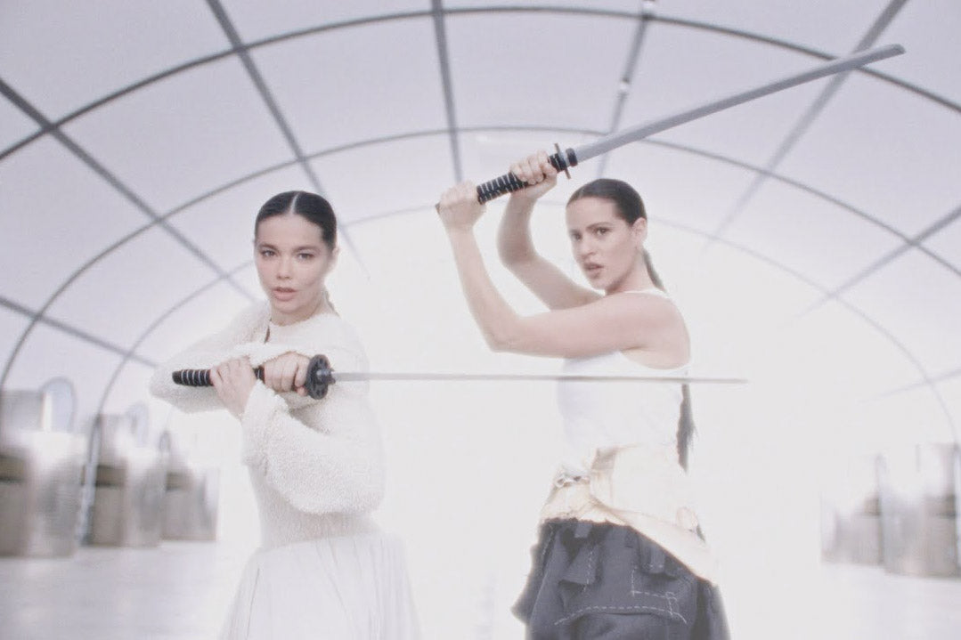 Björk & Rosalía sword fight in video for new benefit single “Oral”