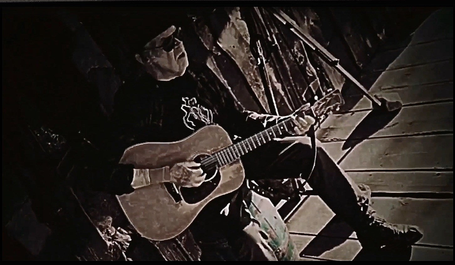watch Neil Young cover Bob Dylan, debut new anti-Trump version of “Lookin’ For A Leader” in porch session