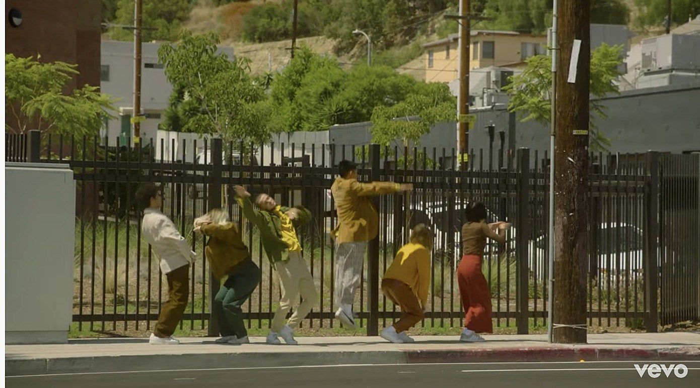 watch New Pornographers’ “Falling Down The Stairs Of Your Smile” video