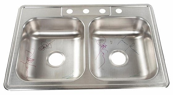 Tool auctioning off an autographed sink for charity