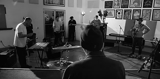 watch Tortoise play “Shake Hands With Danger” at the Joyful Noise headquarters