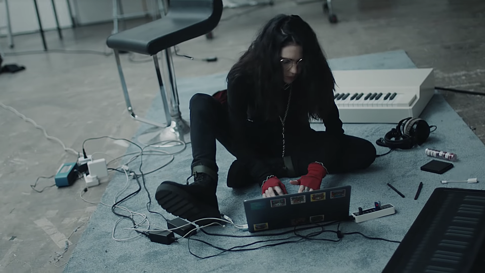 Grimes stars in Mac ad featuring new song “that’s what the drugs are for”