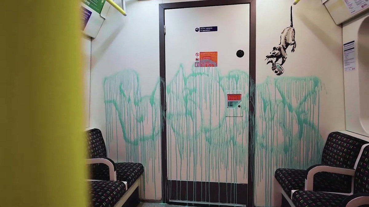 watch Banksy paint COVID-19 art on London Underground system