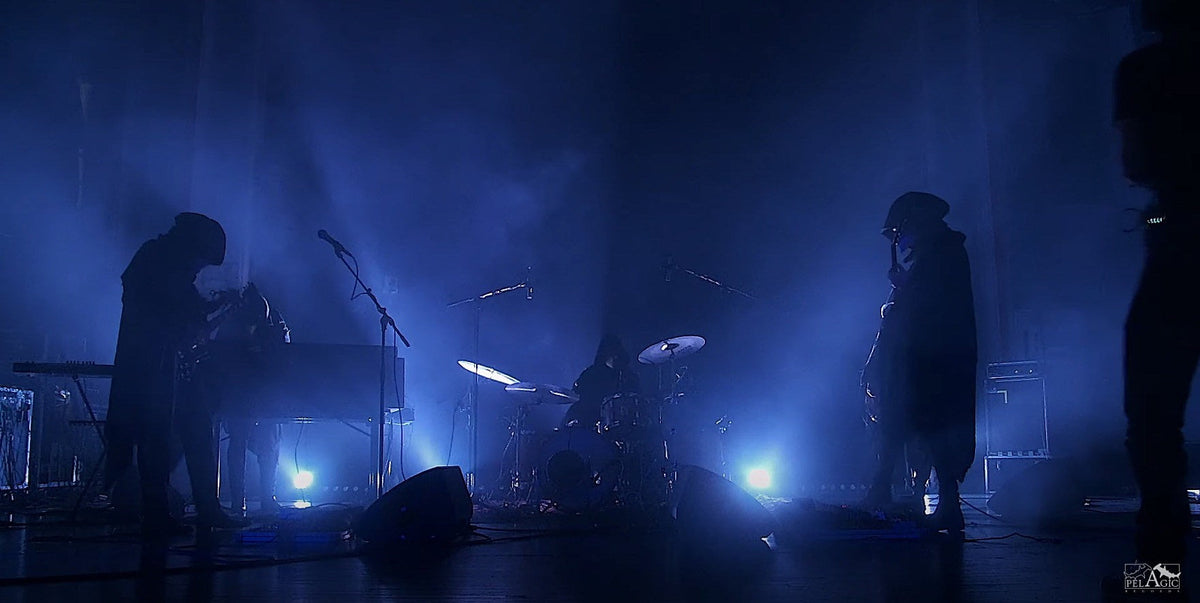 Watch enigmatic post-metallers Briqueville’s new live performance video for “Akte VIII & IX”
