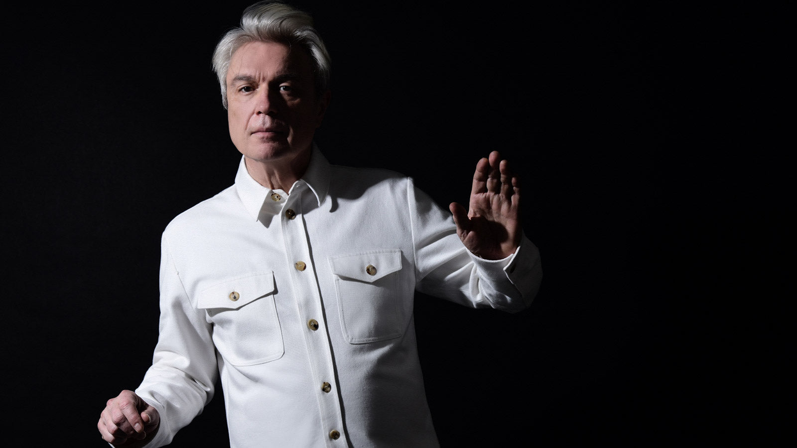 David Byrne taps Brian Eno & Dev Hynes for new single “T-Shirt”