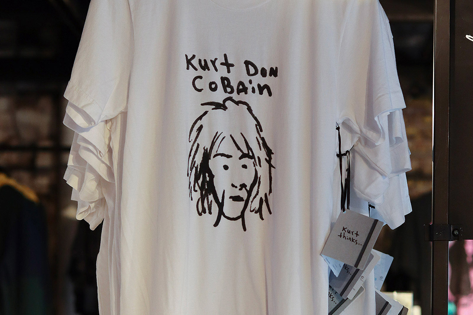 Kurt Cobain clothing collection for sale in NYC ++ sweater and guitar up for auction