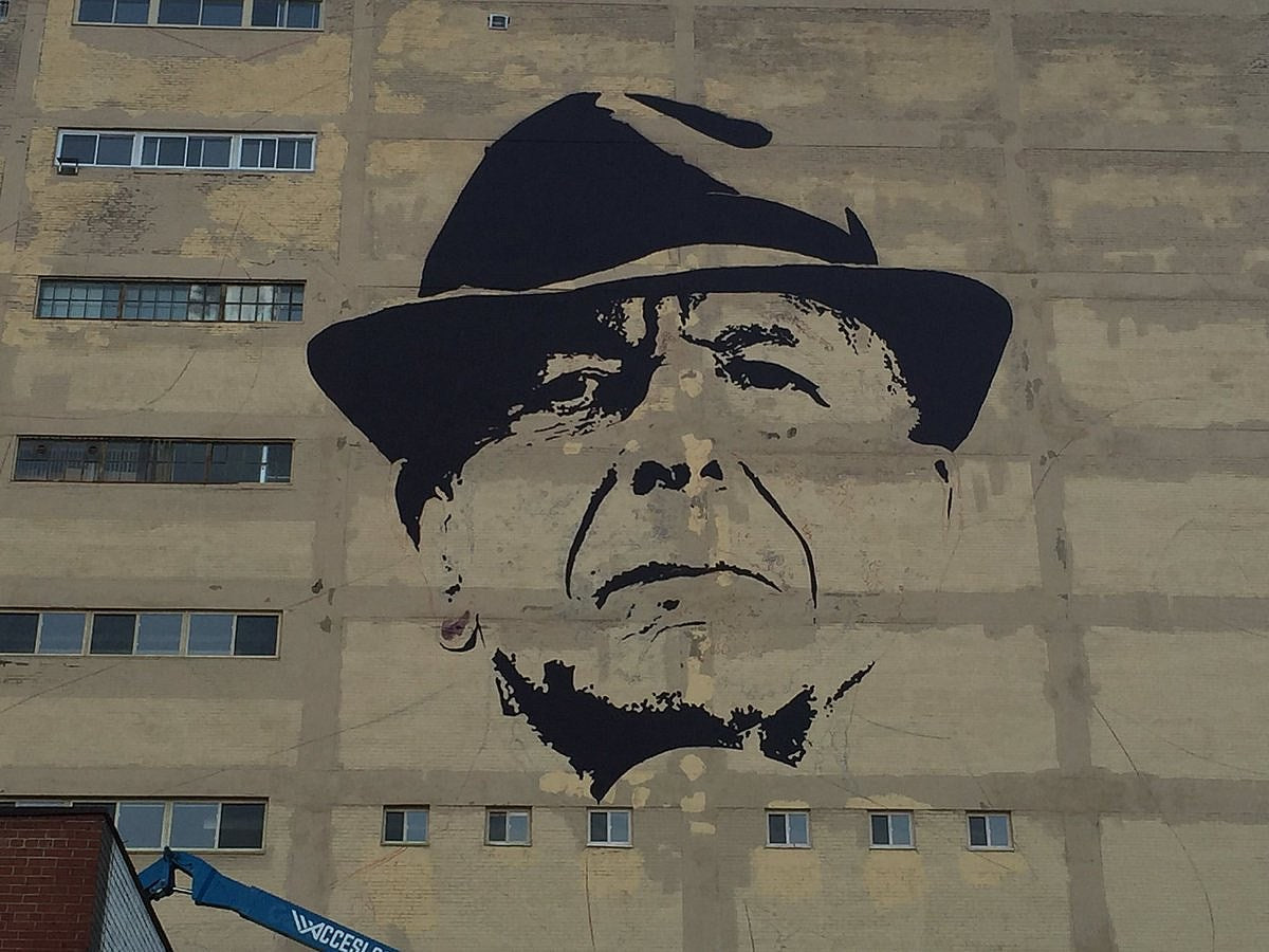 2 giant Leonard Cohen murals appear in Montreal (where an LC exhibition is also opening)