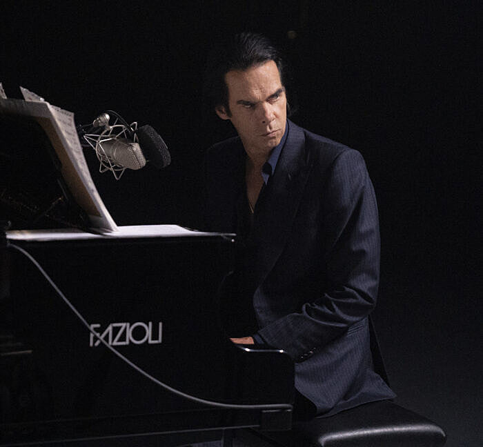 Nick Cave not having much luck getting a free grand piano like the one he plays in ‘Idiot Prayer’ film