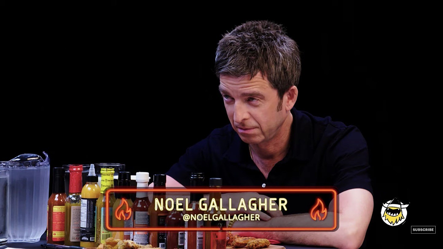 Noel Gallagher talks Kanye, football, UK hip hop & more on ‘Hot Ones’ (watch)