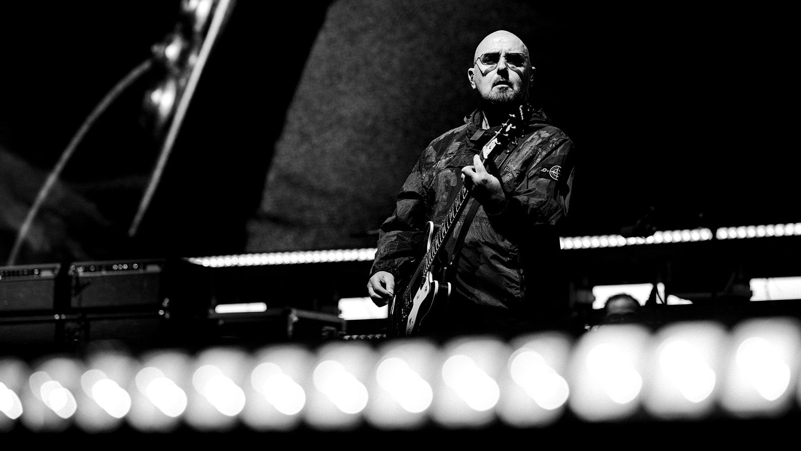 Oasis guitarist Bonehead missing shows to undergo cancer treatment
